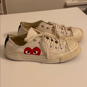 Well loved CDG Converse Play low tops
